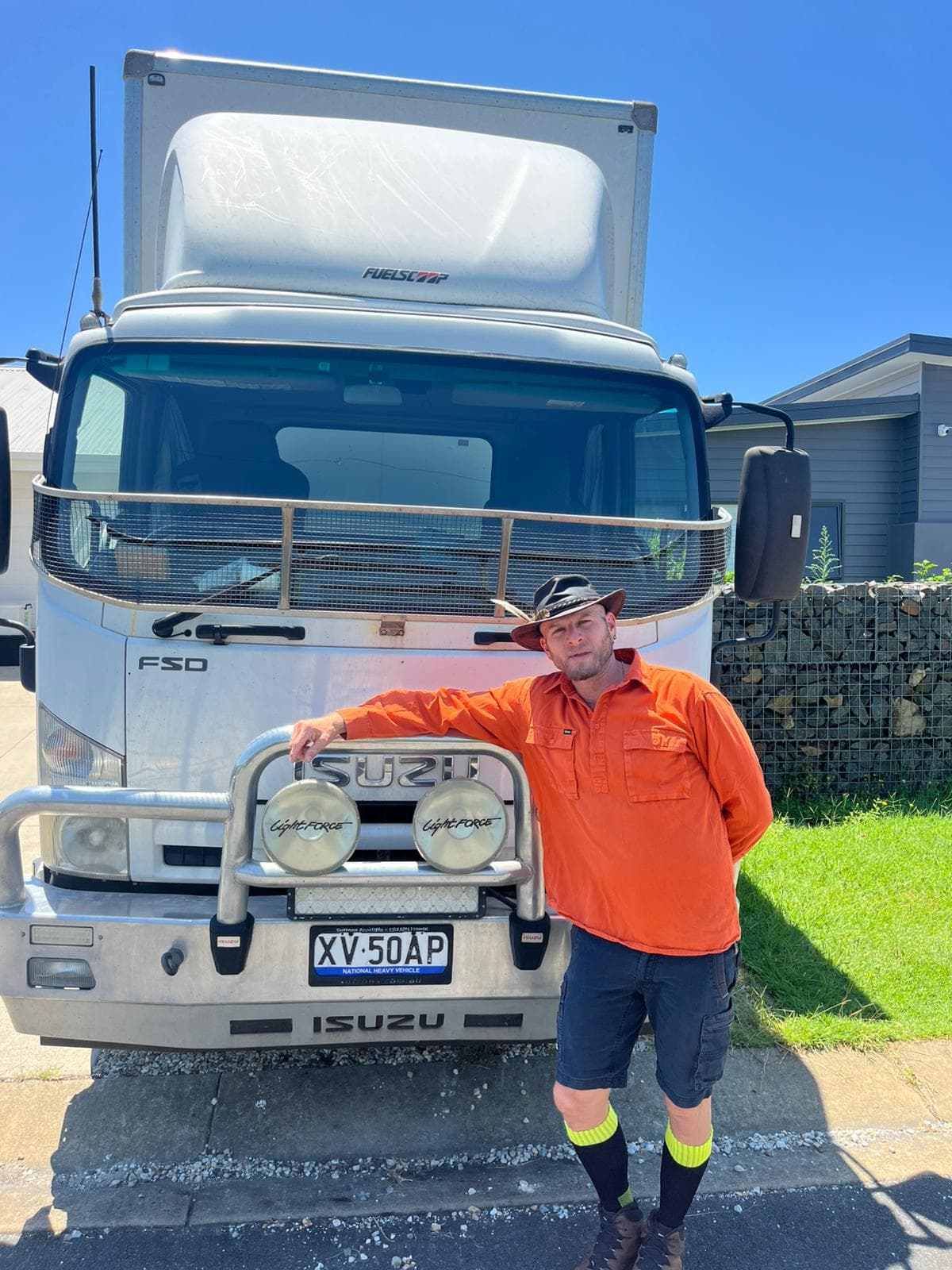 Ariel Raz, founder of Ready To Move, leaning on his Isuzu truck bullbar in Mullumbimby